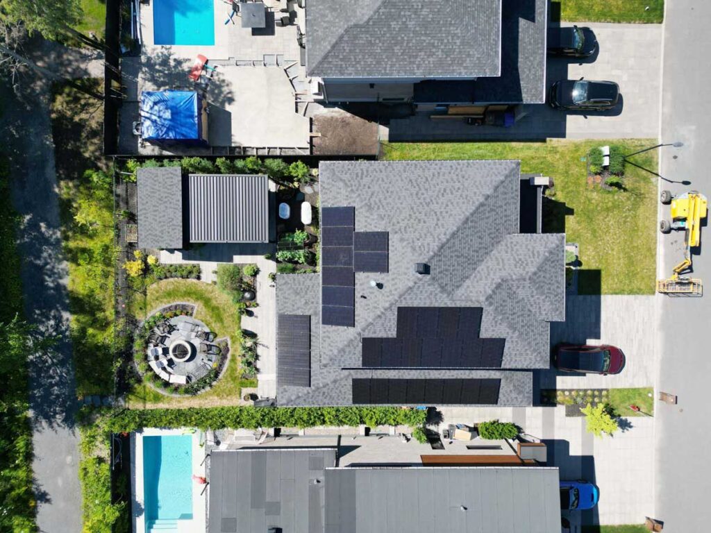 Drone Shot of house in Carignan with solar panels and solar battery backup.