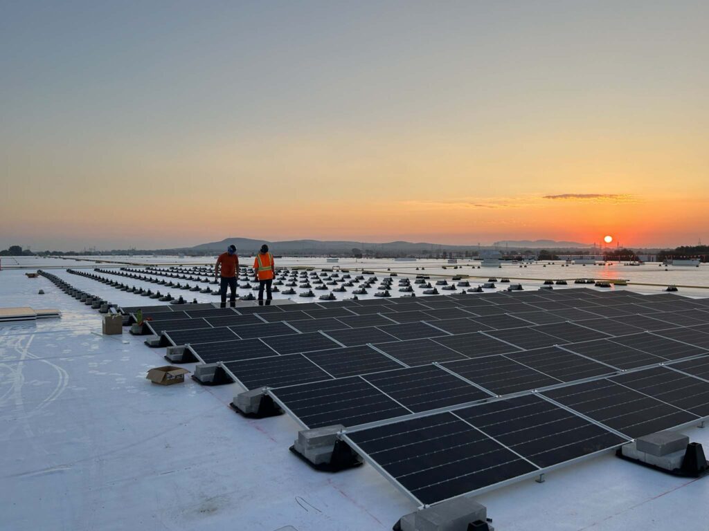Quebec Solar installing panels at sunrise close up